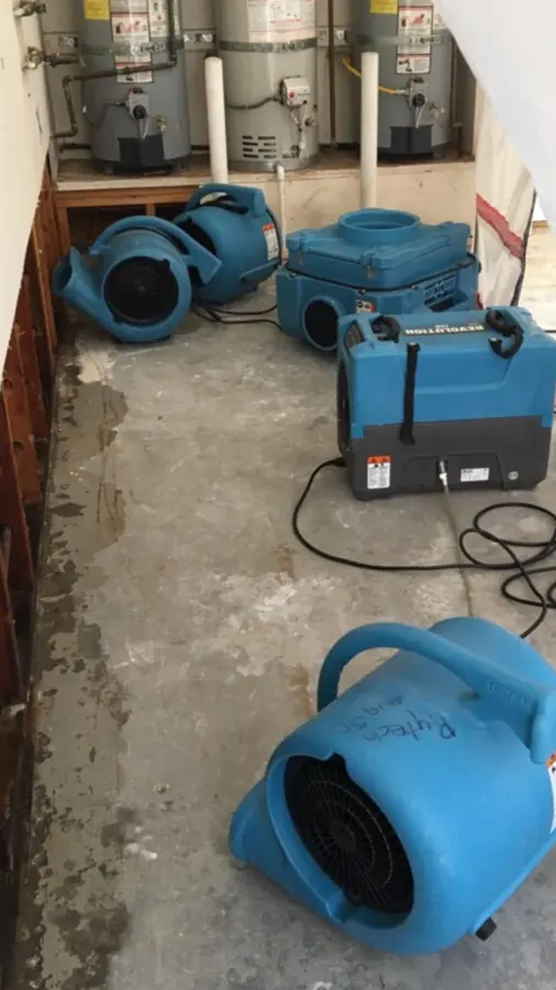 Air movers drying a room after a water loss in Des Plaines